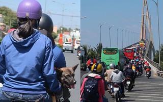 Hàng nghìn người miền Tây đổ lên Sài Gòn chiều tối mùng 6 Tết, mang cả theo gà, chó khiến quốc lộ 1 kẹt cứng