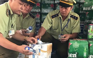 Thu giữ hơn 7 ngàn chai bia Heineken và 15 ngàn chai sữa Ensure có dấu hiệu vi phạm về an toàn thực phẩm