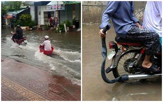 Hình ảnh "bá đạo": "Lướt cano", tắm gội giữa đường phố ngày ngập lụt