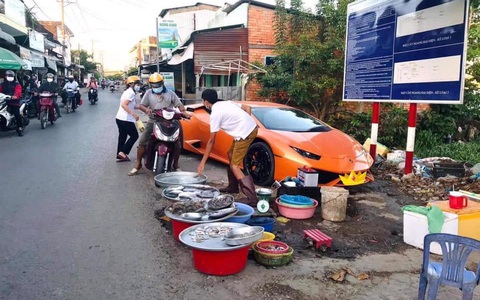 Xôn xao hình ảnh đại gia "kín tiếng" lái siêu xe Huracan 16 tỷ xuống đường để... bán cá?