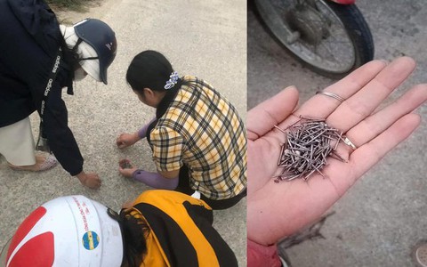 Xe máy thủng săm hàng loạt, nhóm nữ công nhân xuống đường nhặt được cả nắm đinh