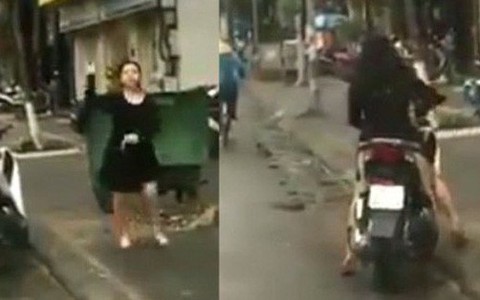Clip xôn xao: Người phụ nữ chửi bới, cầm gạch tương thẳng kính chắn gió ô tô vì tiếng còi xe